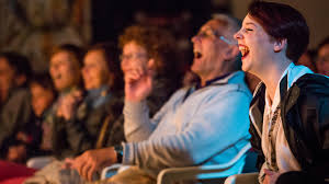 Live audience laughing at a JK Comedy Club stand-up show