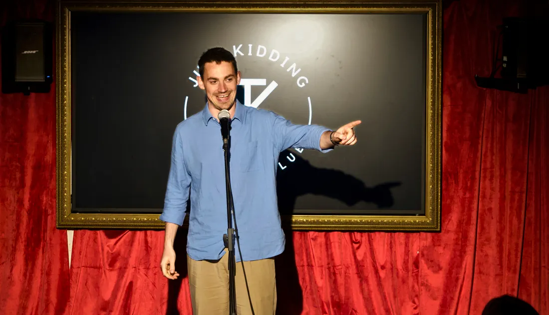 Comedian performing at JK Comedy Club Leicester Square