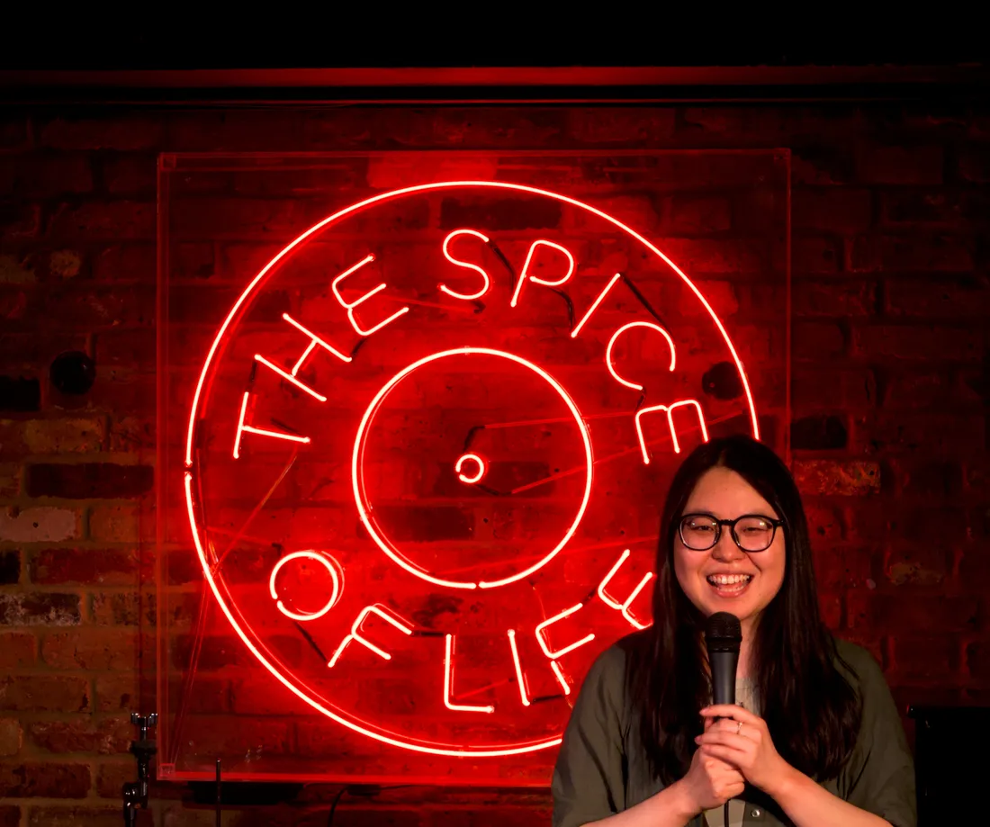 Stand-up comedian on stage at JK Comedy Club Soho