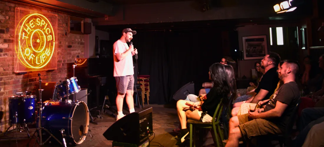 Comedian on stage with the audience at a Wednesday night show at JK Comedy Club Soho